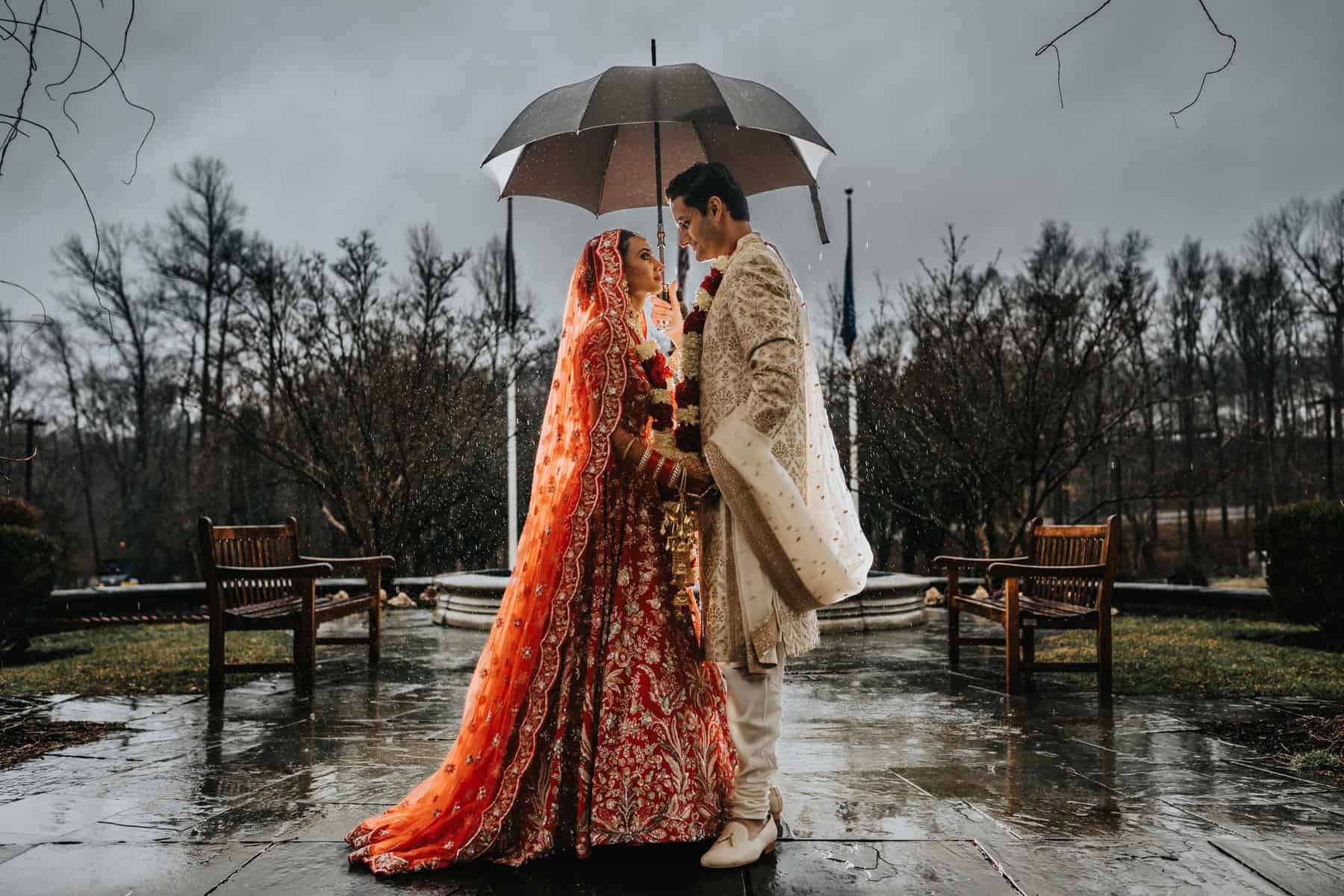 Couple photo during rain on wedding day